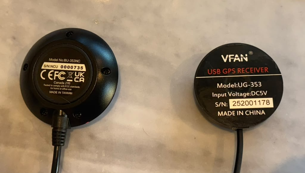 The underside labels of both receivers, showing model BU-353NC and V-FAN USB GPS Receiver model UG-353